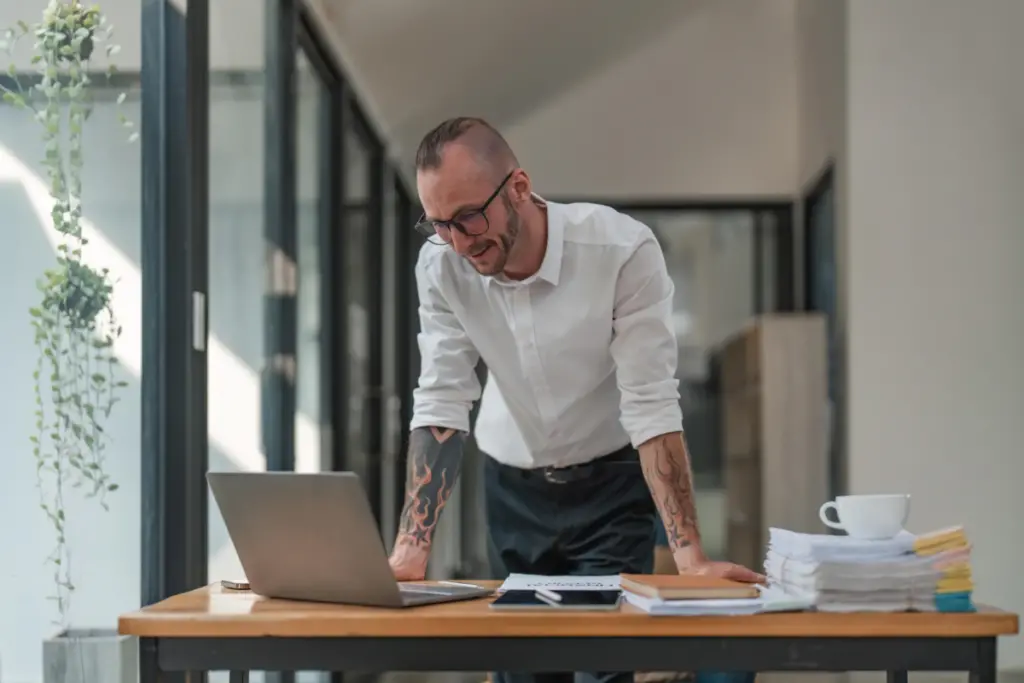 Businessman working with laptop computer at his desk in office